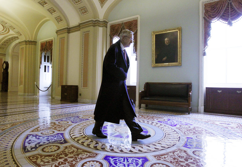 Senate Majority Leader Harry Reid, D-Nev., walks to his Capitol Hill office on Friday. Democrats say Republican obstructionism has led to the current lame-duck session.
