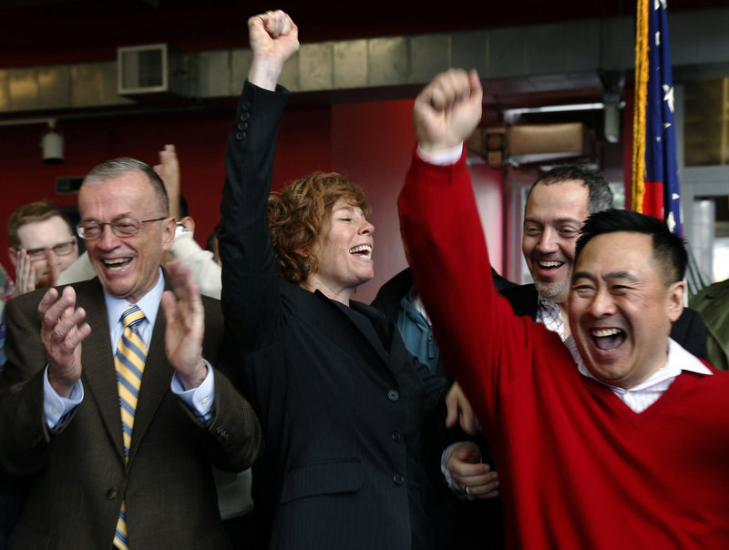 Zoe Dunning, center, a retired Navy commander, celebrates the vote by the U.S. Senate at the LGBT Center in San Francisco, Calif. on Saturday, as lawmakers agreed to do away with the military’s 17-year ban on openly gay troops.