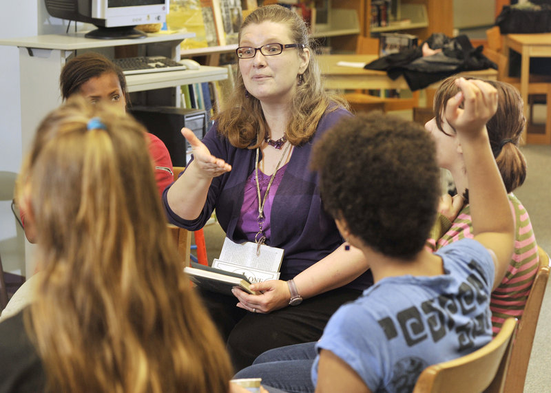 Kelly McDaniel, the librarian at King Middle School, leads a Socratic book circle with sixth-, seventh- and eighth-graders. She was one of 10 librarians nationwide to receive a 2010 I Love My Librarian Award.