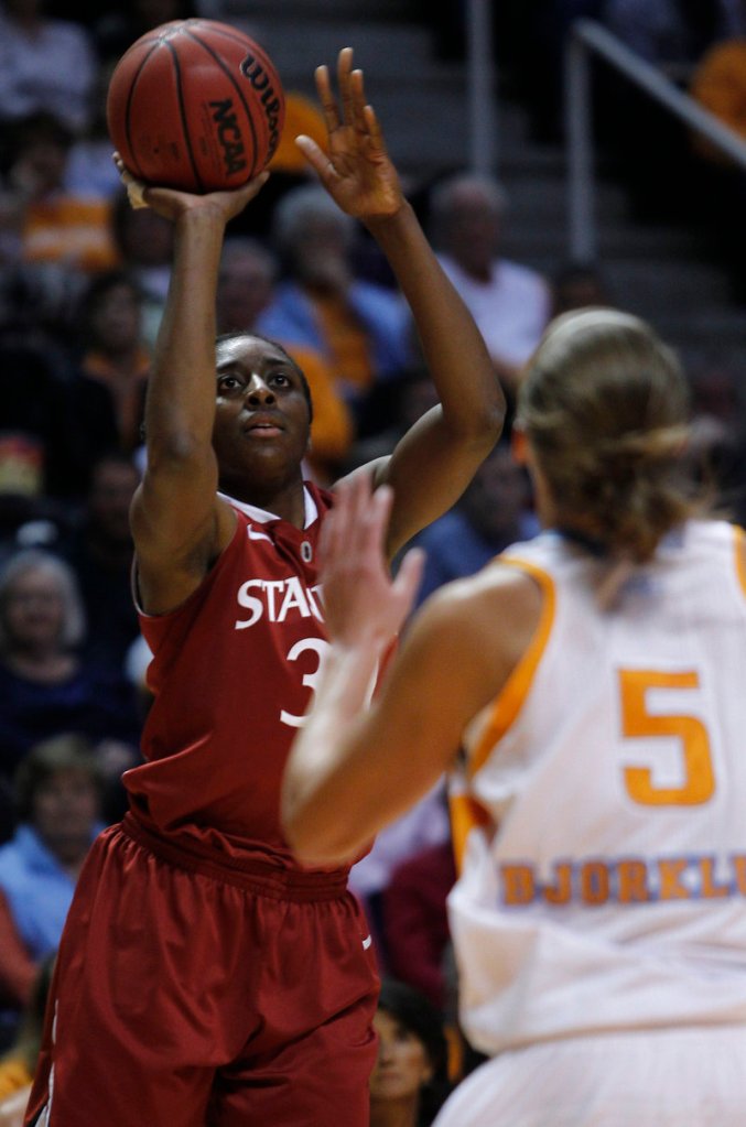 Stanford’s Nnemkadi Ogwumike shoots over Tennessee’s Angie Bjorklund on Sunday in Knoxville, Tenn. The No. 6 Volunteers knocked off the No. 3 Cardinal 82-72 in overtime.