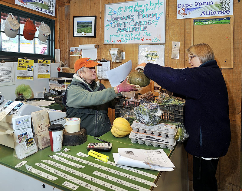 Penny Jordan and her sister, Pam Butterfield, make sure online orders are filled and charged to customers correctly at Jordan Farm in Cape Elizabeth. More information is available on the Cape SoPo Winter Share Facebook page.