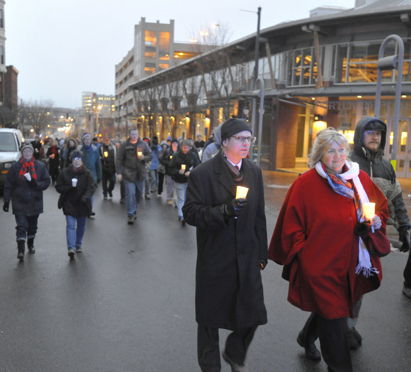 A procession in honor of homeless people who have died heads from the Preble Street Resource Center to Monument Square on Tuesday.