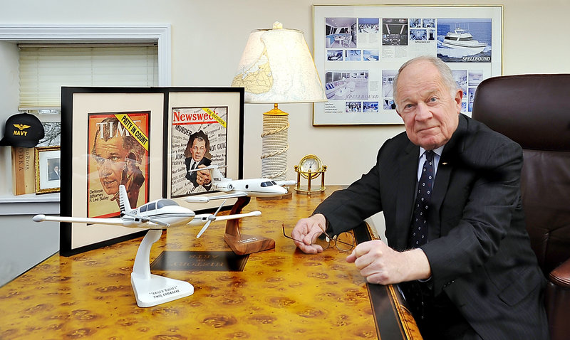 At his desk in Yarmouth, F. Lee Bailey is surrounded by evidence of a life in the spotlight, including covers of Time and Newsweek magazines relating to famous trials, and of his passions, aircraft and yachts.