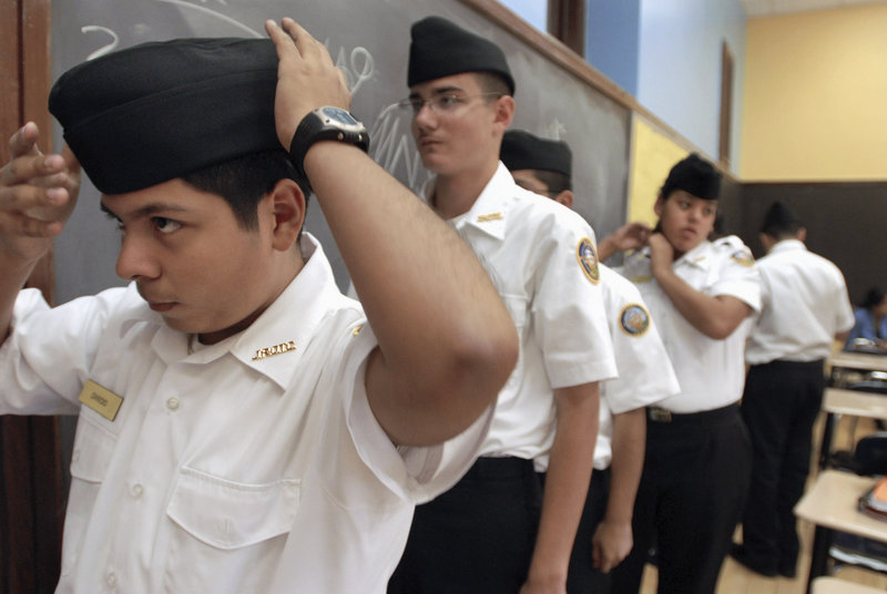 Junior ROTC students at Hyman G. Rickover Naval Academy in Chicago prepare for inspection. The fact that 23 percent of recent high school graduates don’t earn the minimum score needed to join any branch of the military has military and education leaders worried that the pool of young people eligible for service will grow too small.