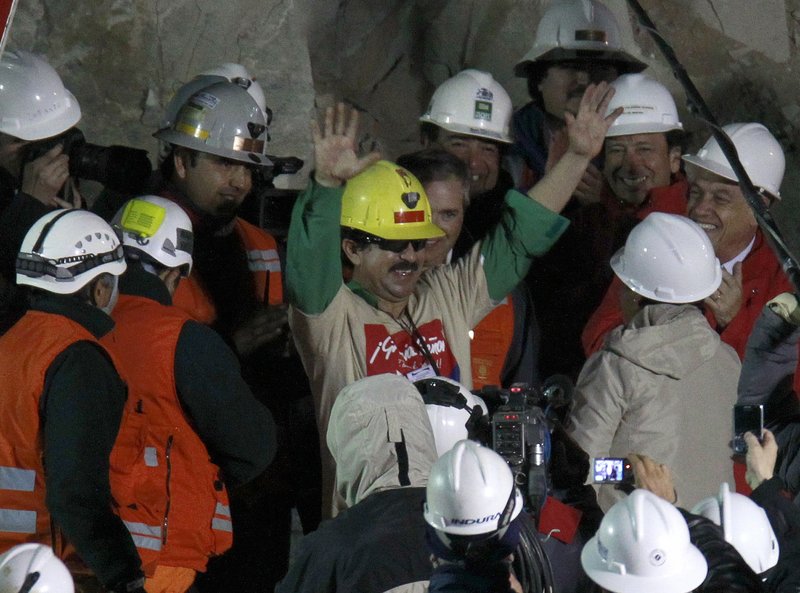 Chilean miner Juan Andres Illanes Palma, the third to be rescued, exits the collapsed San Jose gold and copper mine on Oct. 13. He was trapped with 32 other miners for more than two months.