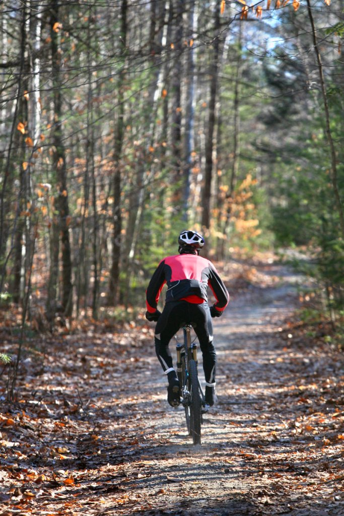 A mountain biker rides along Link Trail in Bradbury Mountain State Park earlier this month. A reader is unhappy with a proposal to expand the corridors available to bikers.