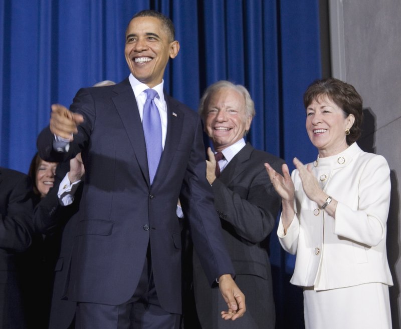 Before signing the repeal of the military’s “don’t ask, don’t tell” policy, President Obama is joined by the bill’s sponsors, Sen. Joseph Lieberman, I-Conn., and Sen. Susan Collins, R-Maine.