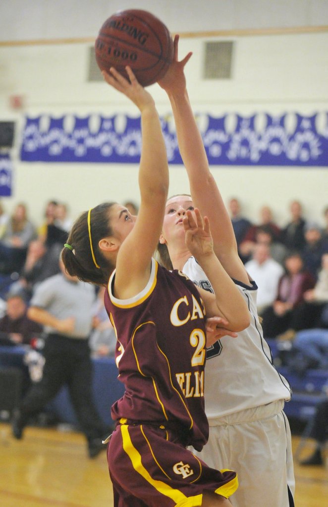 Emma O’Rourke of Cape Elizabeth heads to the basket Wednesday night as Sean Cahill of Yarmouth goes for the blocked shot. Cahill was called for a foul on the play. Cape Elizabeth emerged with a 44-21 victory.