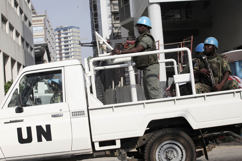 U.N. forces patrol Wednesday in Abidjan, Ivory Coast. At least 50 people have been killed in the West African nation in recent days. The U.S. State Department has ordered most of its personnel to leave because of a deteriorating security situation and growing anti-Western sentiment.