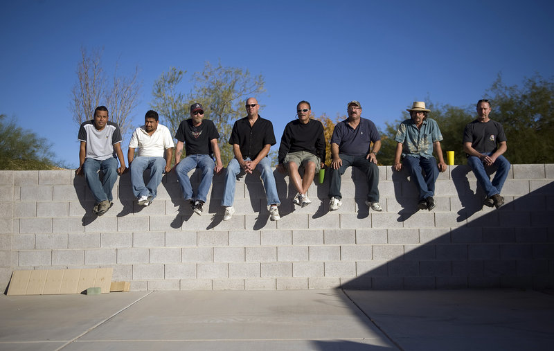 Alberto Pott, Madelio Vaca, Larry Wayland, Chad Wallace, Tony Kuberski, Art Fisher, Jim Brown and Mike Davis are pictured at Brown’s home in Henderson, Nev. All eight of the carpenters worked on the CityCenter project before being laid off because of the recesssion.