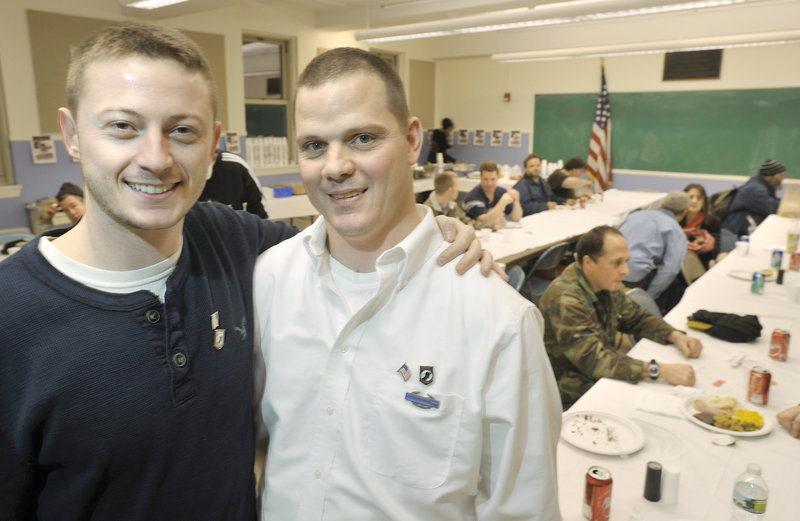 John Myrick, left, and Jake Myrick, his uncle, hosted a Christmas dinner for homeless veterans at the Boys and Girls Clubs of Greater Portland on Saturday. The Myricks are both veterans.