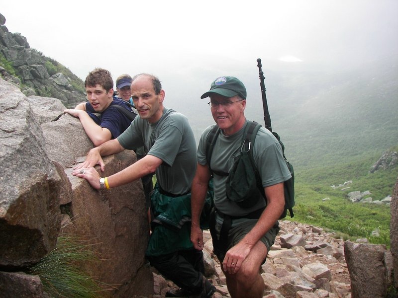 Jack Baldacci, Sheryl Tishman, Gov. John Baldacci and Baxter State Park Director Jensen Bissell, from left, posed on July 11, 2007, on the Saddle Trail of Mount Katahdin near Millinocket. Baldacci hiked up the mile-high mountain, Maine’s tallest, with his son Jack and several others. Baxter State Park officials said he was the first sitting governor in more than 30 years to climb Katahdin. Baldacci protected access to many of Maine’s special places, despite significant land sales.