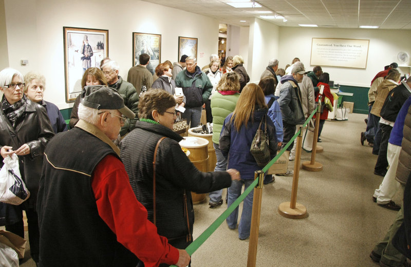 Shoppers line up with returns and exchanges at L.L. Bean in Freeport on Sunday. Other shoppers were out looking for bargains.