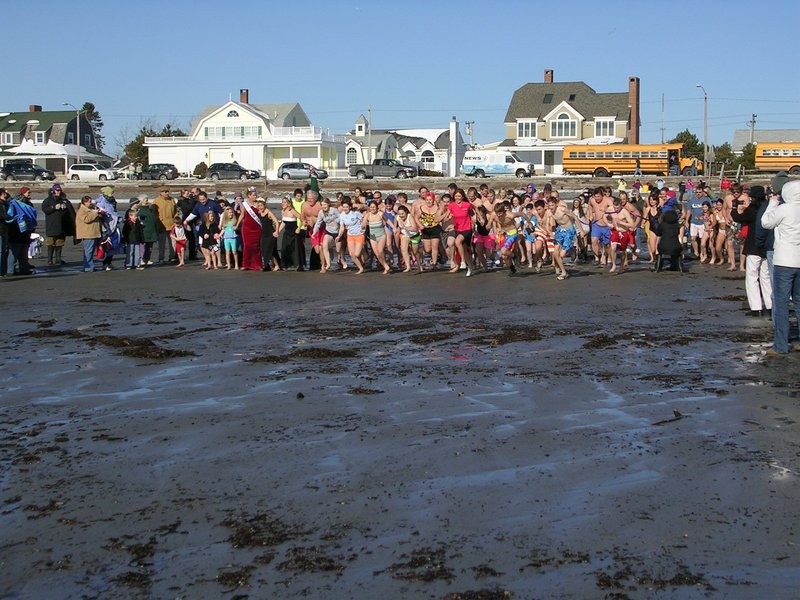 Caring Unlimited will provide the dip for its New Year's Day party. The 10th annual Atlantic Plunge at Gooch s Beach is set for 11 a.m. Saturday. Pictured are participants last year.
