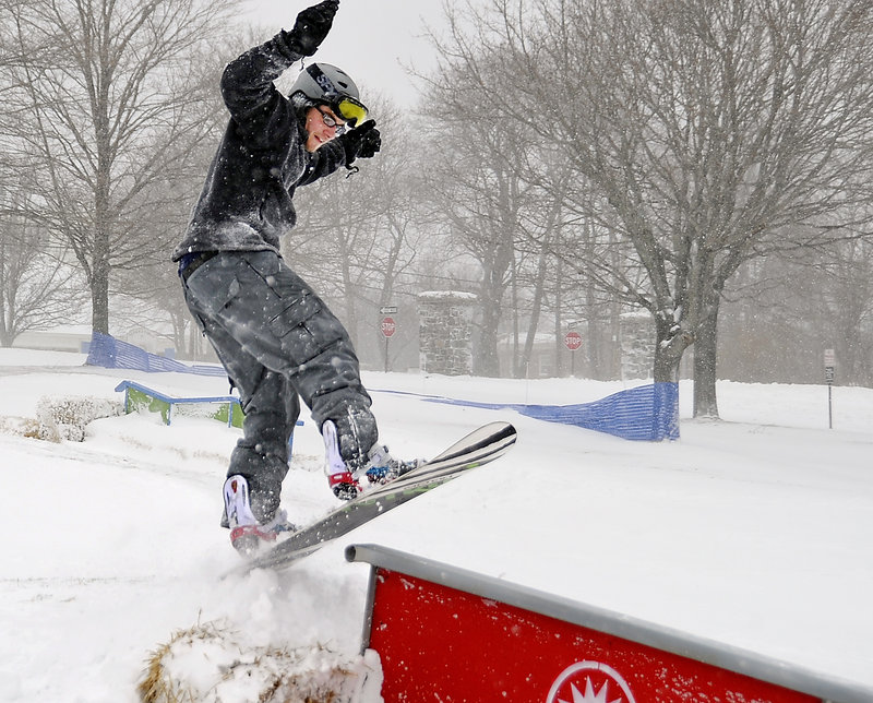 Brent Legere jumps onto a rail at Payson Park’s terrain park. The park has grown rapidly in the past two years, thanks to donated terrain park features and snow guns. The park will have free skiing and riding lessons available on Wednesday afternoons starting Jan. 5.