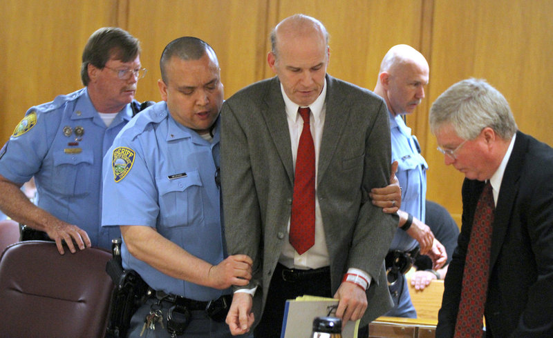 Scott Roeder is led from the courtroom after he was given a life sentence by Sedgwick County District Court Judge Warren Wilbert in Wichita, Kansas, on April 1. Roeder was convicted last January of murdering Wichita abortion doctor George Tiller in May 2009 as he ushered at his church.
