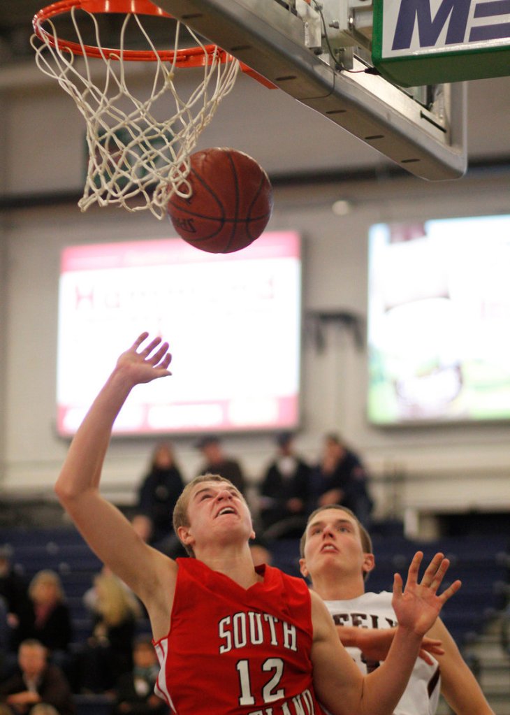 Ben Burkey of South Portland, gaining inside position for a rebound against Greely later in the day, was one of the players who benefited from playing time in the early game, scoring 19 points against Mountain Valley.