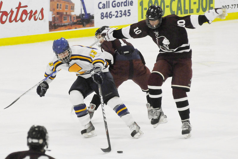 Brandon Tuttle of Falmouth reaches for the puck against North Haven, Conn. The tournament has grown from six teams to 38, including 18 from out of state.