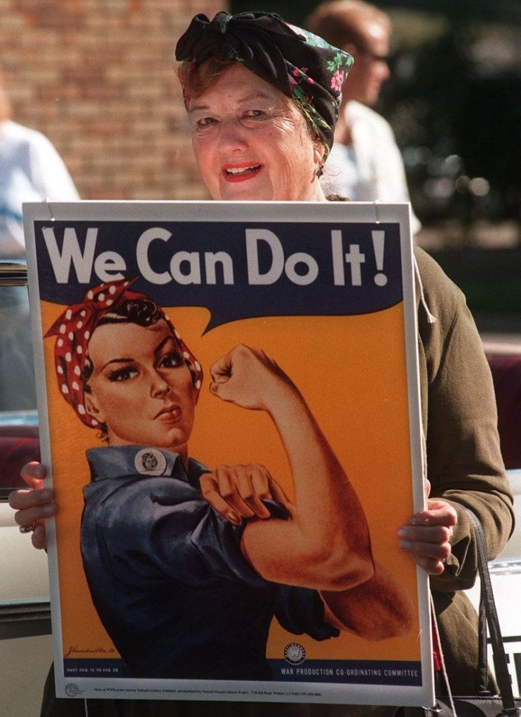 Geraldine Doyle poses with the famous World War II “Rosie the Riveter” poster that was made with her likeness.