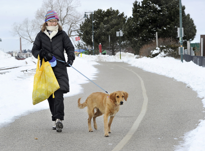 Annya Fischer and her dog Monty enjoyed a walk along the Eastern Prom Trail on Friday.
