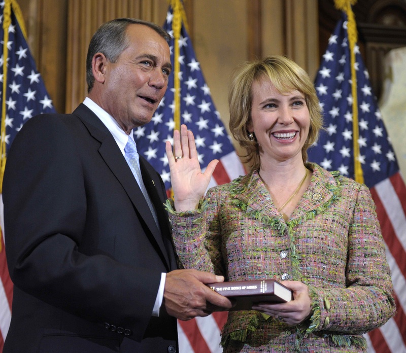 House Speaker John Boehner re-enacts the swearing in of Rep. Gabrielle Giffords, D-Ariz., last Wednesday on Capitol Hill in Washington. Giffords was shot in the head today in Arizona.