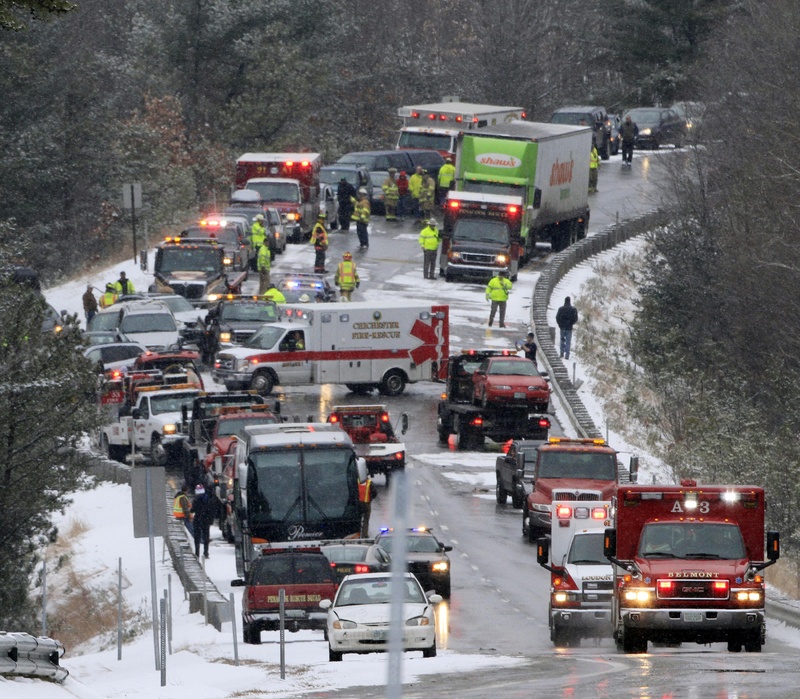 Emergency crews help victims of a multi-car accident on Interstate 93 , today in Canterbury, N.H. New Hampshire State Police say a collision involving at least 30 cars and a bus during whiteout conditions temporarily shut down Interstate 93 southbound in Canterbury.