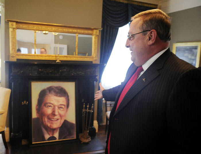 Paul LePage admires a portrait of Ronald Reagan in the Blaine House this morning.