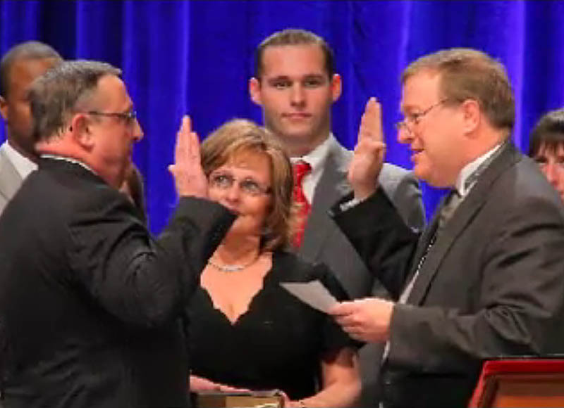 Paul LePage, left, is sworn in as Maine's new governor by Senate President Kevin Raye. R-Perry.