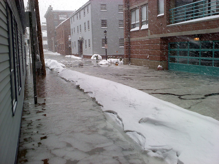 This photo shows flooding at high tide on Portland Pier shortly before noon today. Photo submitted by Darrick X. Banda.