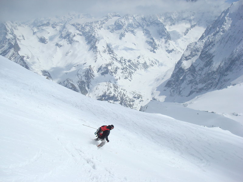Warren Cook skis down a Swiss slope after climbing it.