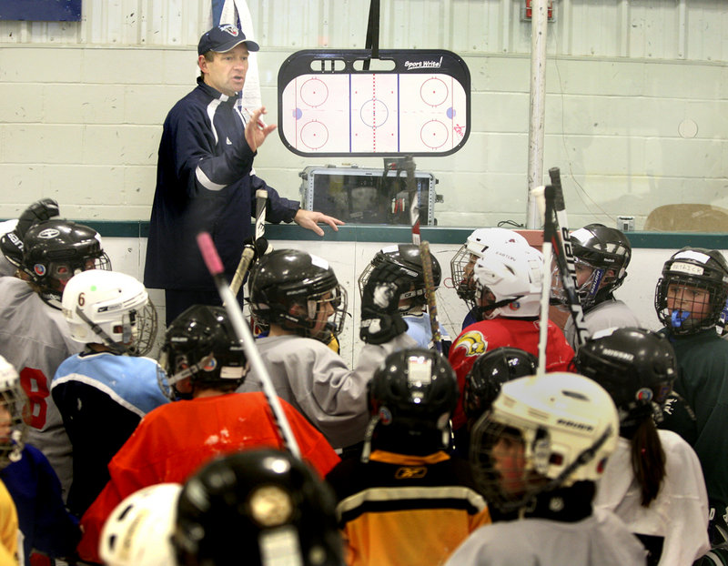 Tim Whitehead, the University of Maine men’s hockey coach, discusses the clinic that’s about to begin with 70 young players from Casco Bay Youth Hockey, a Greater Portland-based organization, during a day of getting together Saturday at Family Ice in Falmouth.