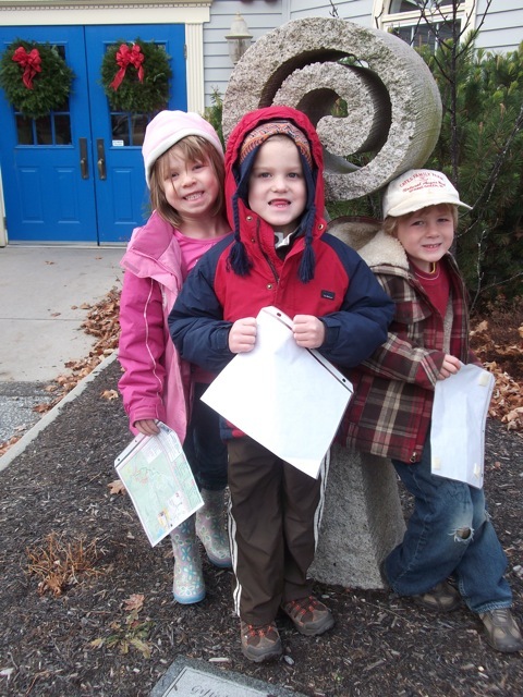 With maps in hand, three Fiddlehead Art & Science Center kindergartners get ready for an excursion to the Libby Hill Preserve in Gray.