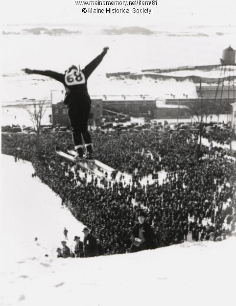 A ski jumper flies off a wooden structure on the Western Promenade in Portland built for the 1924 Winter Carnival. More than 5,000 spectators came to see this event.