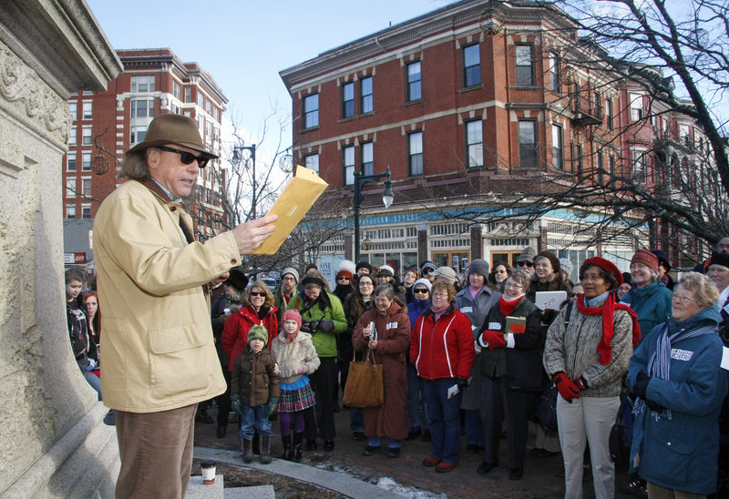 Portland’s poet laureate Steve Luttrell reads one of his works, “Machigonne,” at Longfellow Square.