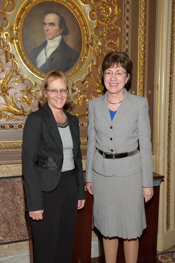 Sen. Susan Collins, right, congratulates Brunswick Teacher Maria Palopoli for being honored with the Presidential Award for Excellence in Mathematics and Science Teaching.