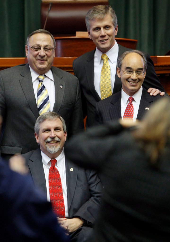 Gov. Paul LePage, top left, with Secretary of State Charles Summers, top, Treasurer Bruce Poliquin, right, and Attorney General William Schneider, at the Statehouse Thursday.
