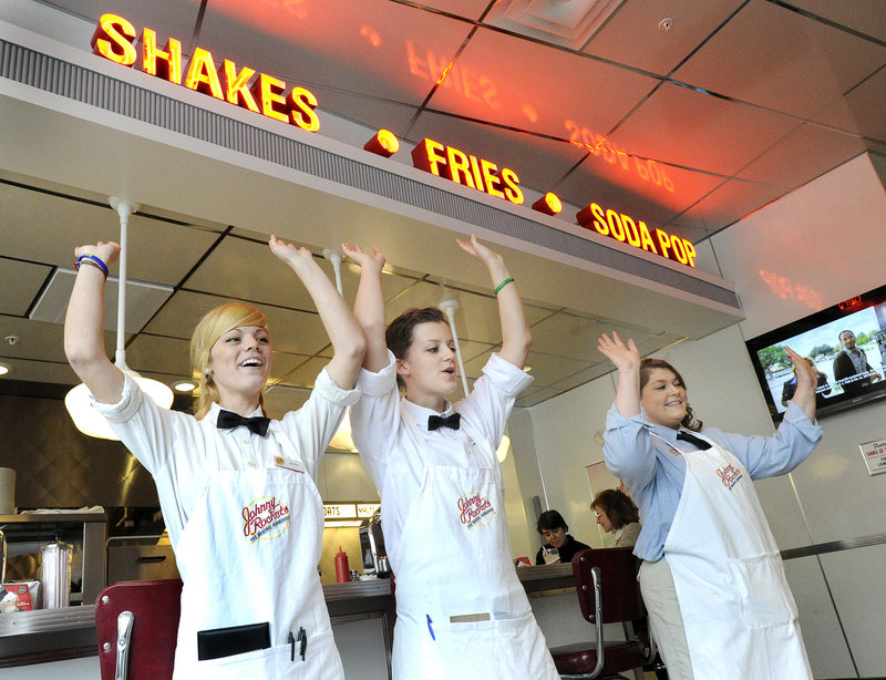Servers Britney Holtan, Caitlyn Robitaille and second manager Crystal Duval raise the roof at Johnny Rockets.
