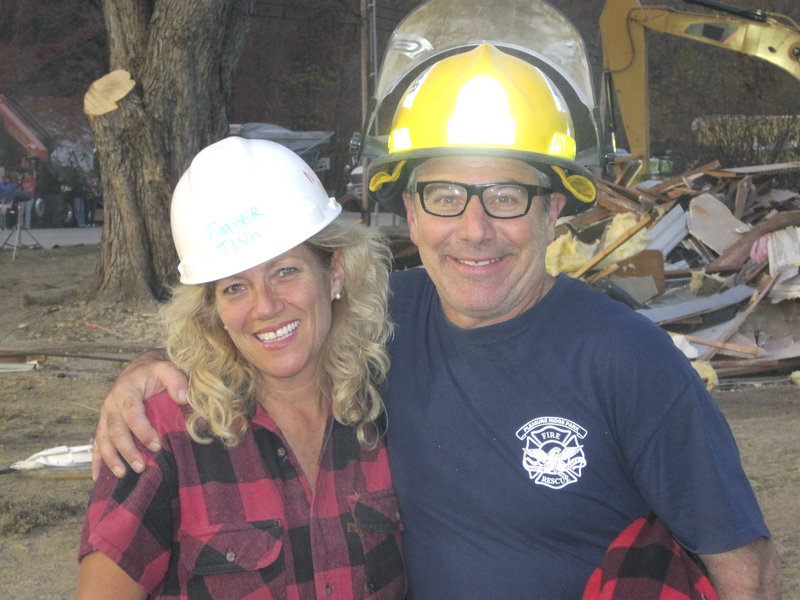 Tina Scheer, owner of the Great Maine Lumberjack Show, poses with designer Paul DiMeo on the set of ABC’s “Extreme Makeover: Home Edition.”