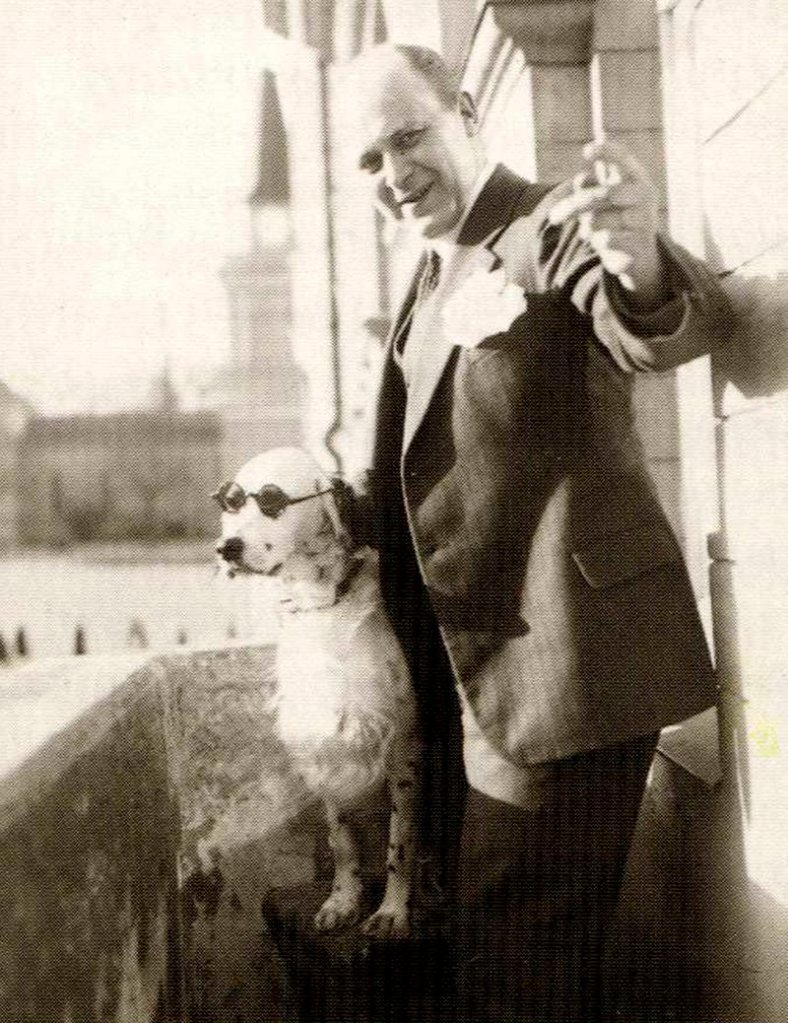 Photo shows Finnish businessman Tor Borg and his dog Jackie, wearing a pair of sunglasses. The dog was dubbed “Hitler” by Borg’s wife as it raised its paw in a Nazi salute, prompting a German investigation of the owner.