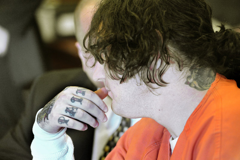 Tattoos that appear to spell the word “pain” adorn defendant Chad Gurney’s fingers during his trial Monday in the May 2009 slaying of 18-year-old Zoe Sarnacki in Portland.