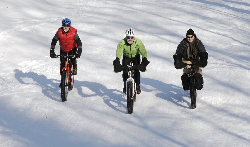 Alexander, Fenlason and Clarke, from left, are part of a growing group of fat-bike riders in Maine. They say the bikes give them the freedom to ride any terrain.