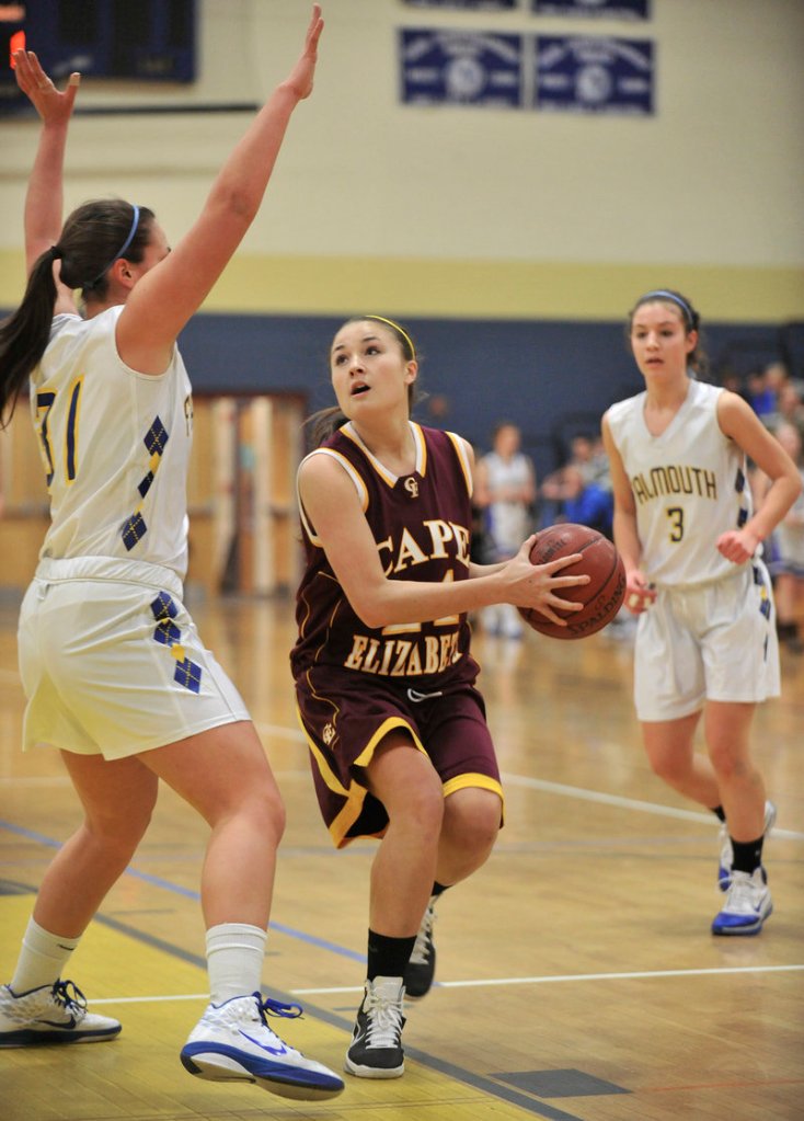 Kisa Tabery of Cape Elizabeth looks to the basket as Jenna Serunian of Falmouth defends Tuesday night. Serunian had 11 points for Falmouth.
