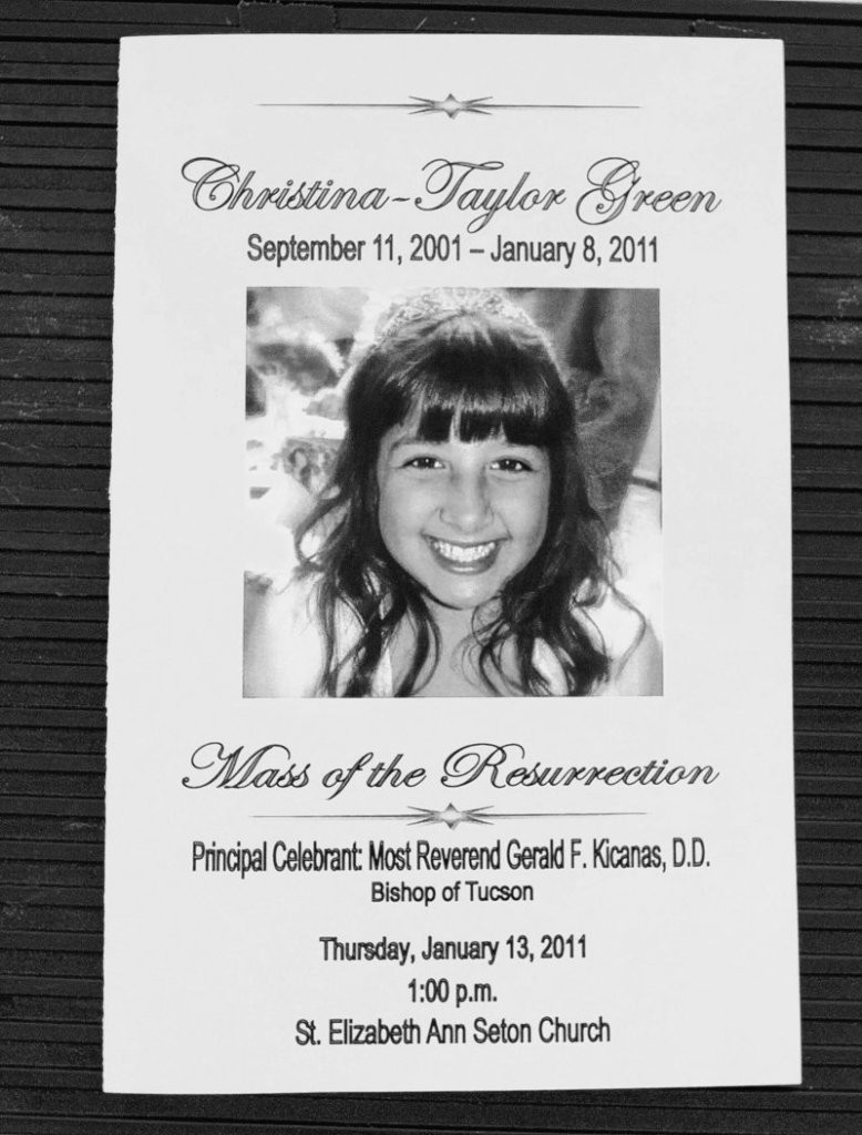 A program for Christina Taylor Green’s funeral is displayed at St. Elizabeth Ann Seton Church on Thursday in Tucson, Ariz.