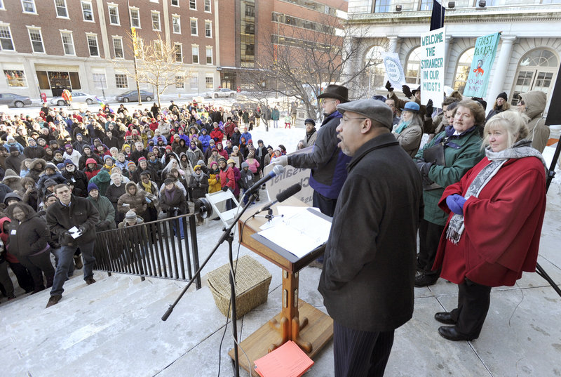 The Rev. Kenneth Lewis Jr., pastor of Green Memorial AME Zion Church, quotes Martin Luther King Jr. on the steps of Portland City Hall during a rally Monday.