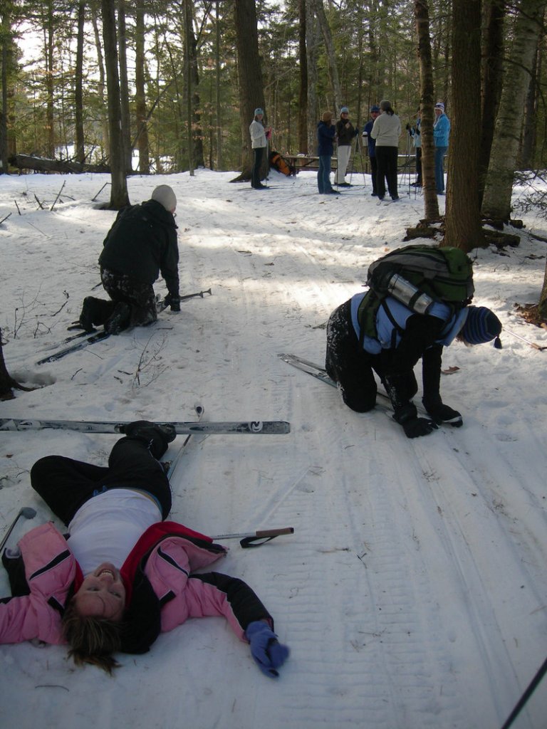 Novice cross-country skiers take a simultaneous spill during a Walk-On Adventure at L.L. Bean in Freeport.