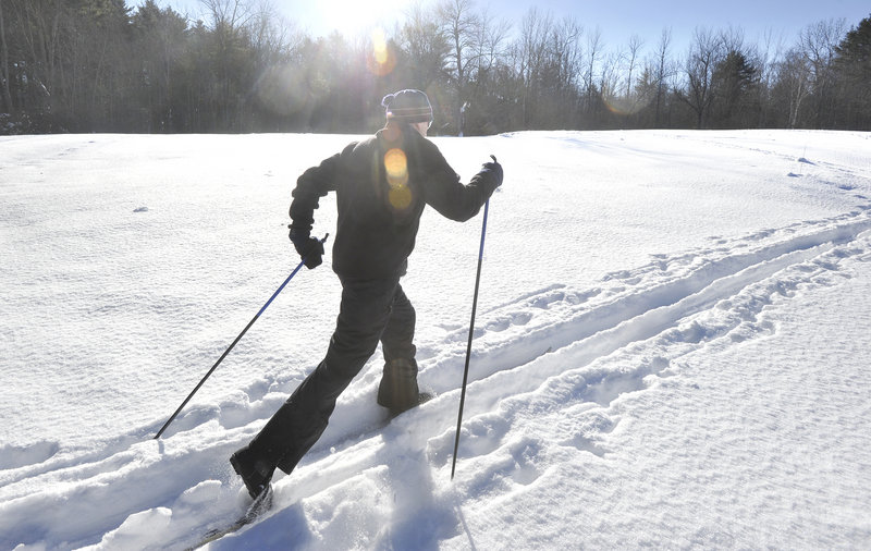 Ralph Keyes, a teacher at Wiscasset High School, glides across a field section of the new trail system at the Merrymeeting Fields Preserve in Woolwich. The trails offer families the chance to learn how to cross-country ski.