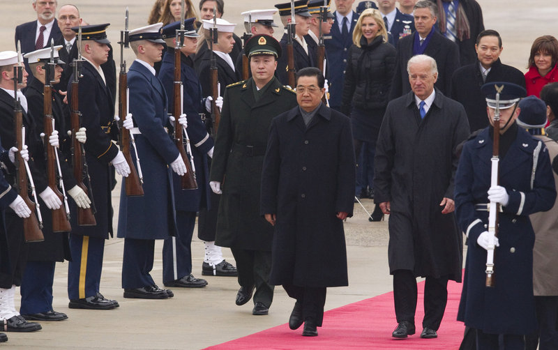 Chinese President Hu Jintao and Vice President Joe Biden walk the red carpet at Andrews Air Force Base on Tuesday. When President Obama and Hu sit down this week, the concerns of America's manufacturers should play a prominent role.