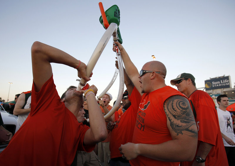 Miami football fans party before a recent college football game between Miami and Florida State in Miami. A study found sports fans younger than 35 were nine times likelier to be above the legal limit for blood alcohol after a game.