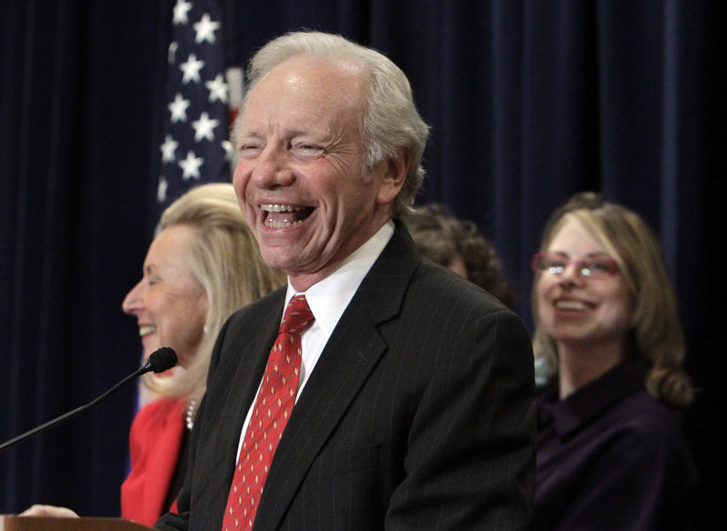 U.S. Sen. Joseph Lieberman, I-Conn,, accompanied by his wife, Hadassah, and daughter Rebecca Lieberman Wisse, announces his decision Wednesday not to seek another term in the U.S. Senate.