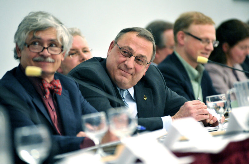 Gov. Paul LePage, center, listens as panel members speak about environmental concerns Thursday during the Roundtable on Maine People and the Environment.